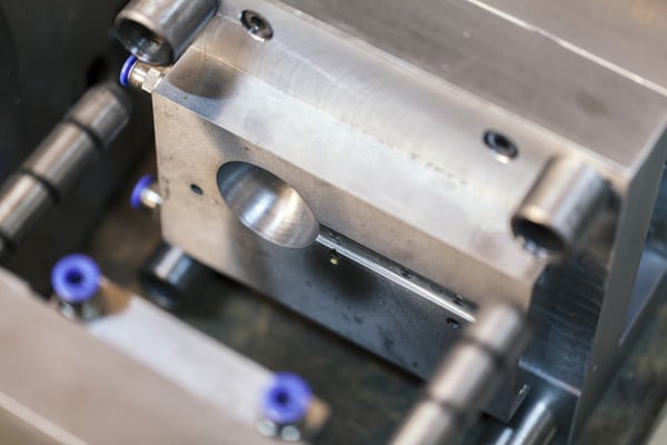 Close-up of metal mold during the injection molding process.