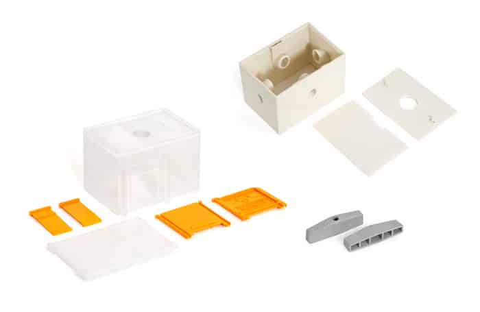 white plastic molded components with orange details