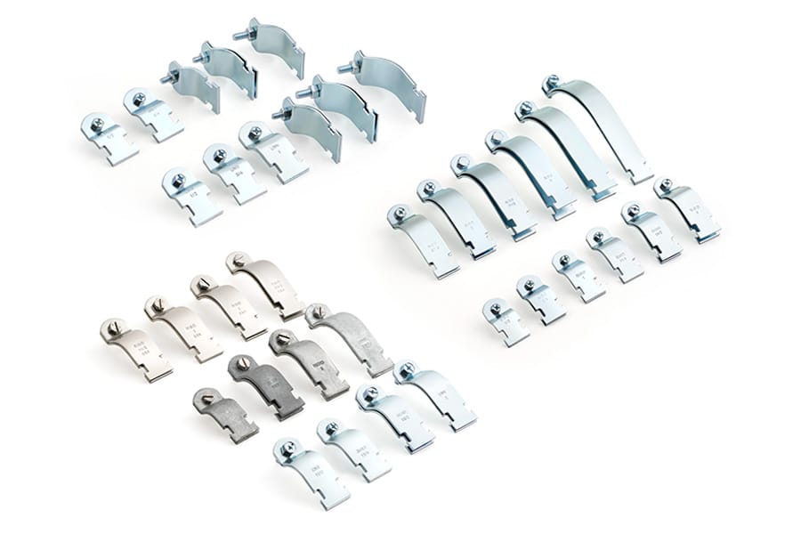 Set of metal brackets with silver plating on white background.